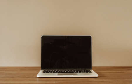 Computer on wooden desk. Copy space.の写真素材