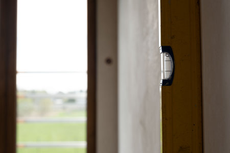 Spirit level next to wall in new buildingの写真素材