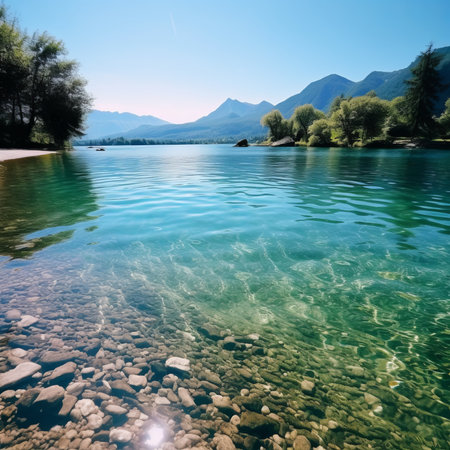 A large crystal clear lake in the middle of majestic mountains. Concept of peace in natureの素材