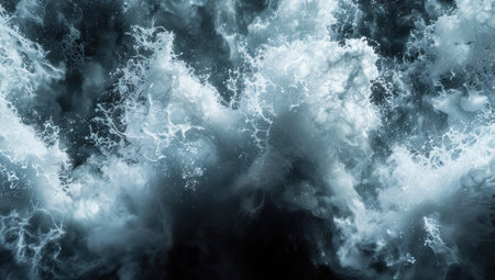 A large splash of white liquid on a black background in a dynamic and powerful momentの素材