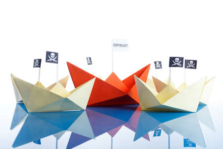 Pirate Origami Ship with black flag on background