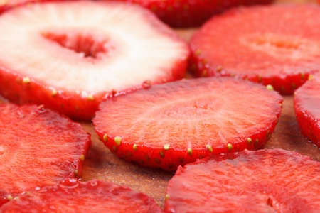 Few fresh strawberries on old wood boardの写真素材