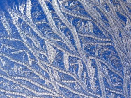 Ice patterns on winter glass. Frost windowの写真素材