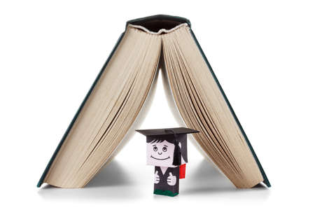 Student and the book as a house. The concept of school. Isolated on white backgroundの写真素材