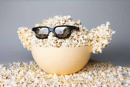 Smiling Monster of popcorn, glasses. Cinema, the audience watching comedy humorの写真素材