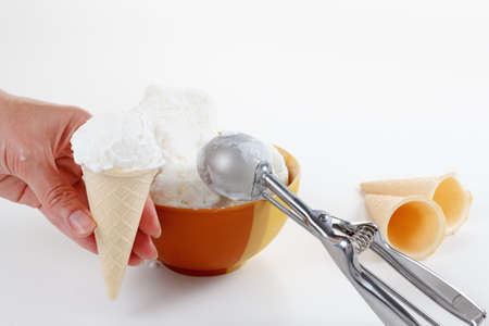Chef makes the ball ice cream in a cone, waffle cupの写真素材