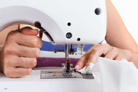 Sewing Process - Women's hands behind her sewingの写真素材