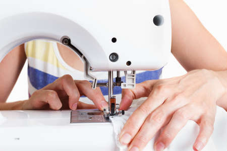 Sewing Process - Women's hands behind her sewingの写真素材