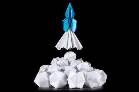 Concept of successful business or strategy, e.g. for app development or business startups. The rocket launch in white cloud of smokeの写真素材