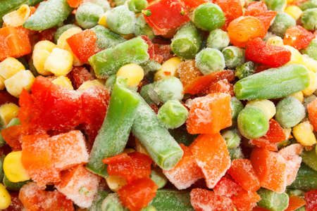 Frozen vegetables with ice closeup in studioの写真素材