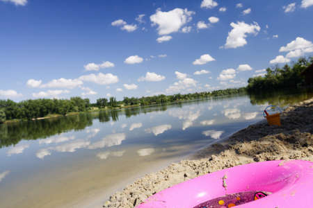 Sandy beach on the river outside the cityの写真素材
