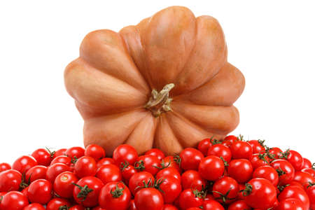 Bunch of ripe red tomatoes and pumpkin isolated on a white background. Suitable for harvestの写真素材