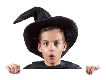 Teen boy in carnival costume wizard. Isolated on white background