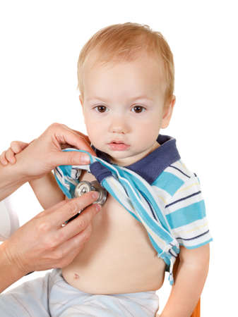 Happy little boy, health exam at doctor's office. Isolated on white backgroundの写真素材