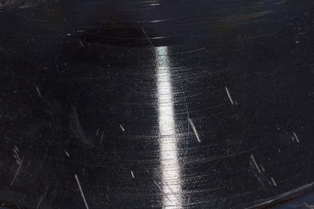 Closeup of old dusty scratched vinyl records