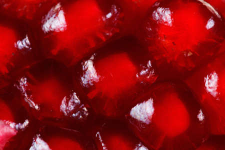 Ripe red berries pomegranate, macro. It can be used as backgroundの写真素材