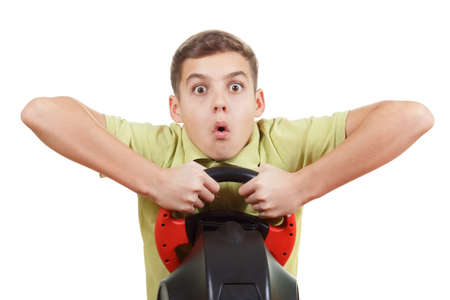 Boy playing with a wheel Game, emotion of surprise on his face, isolated on whiteの写真素材