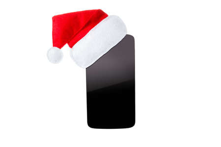 Smart phone christmas concept, santa hat, Isolated on white background. Closeup, copy spaceの写真素材
