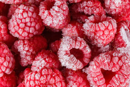Frozen Raspberry red background with ice. Closeupの写真素材