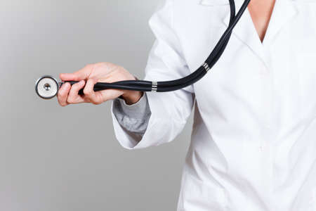 Doctor with stethoscope in the hand,medical uniforms, isolated on white backgroundの写真素材