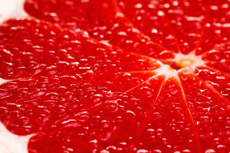 Bacground of ripe Grapefruit Slice, fresh fruit texture closeupの写真素材