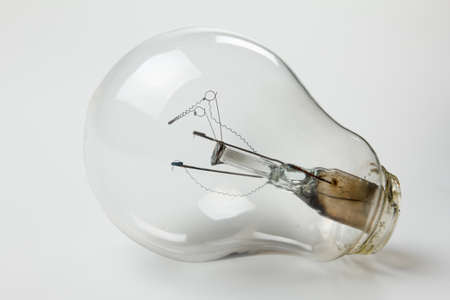 Old burnt lamp smoked inside. Closeup studio shotの写真素材