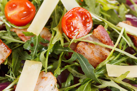 Fresh salad with bacon, cherry tomatoes with arugula and Parmesanの写真素材