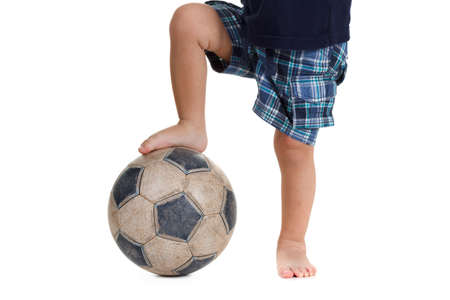 Soccer ball on the foot of a caucasian football player.  Isolated on white backgroundの写真素材