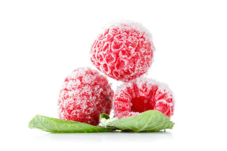 Frozen raspberries macro with mint leaves and ice  isolated on white backgroundの写真素材