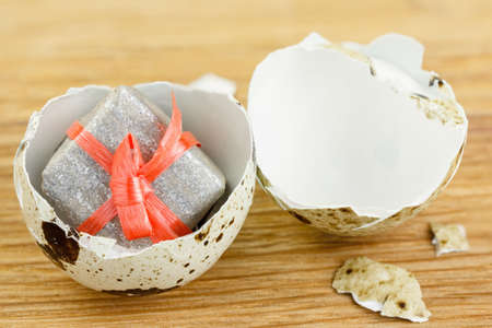 The concept of a pleasant surprise and a gift. Discovery or idea. Gift box in the egg.