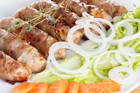 Delicious pork bacon roll, cooked with salad, closeupの写真素材