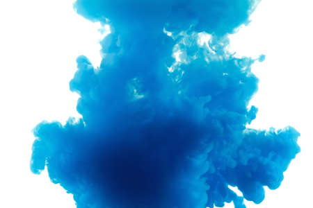 Color drop in water, photographed in motion. Ink swirling in water. Cloud of ink in water isolated on white background. Colorful ink in water, ink drop.の写真素材