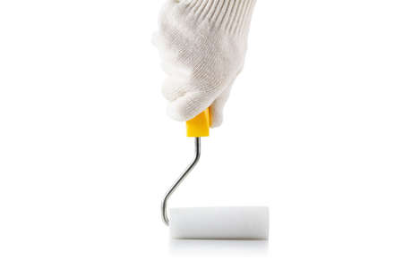 Paint roller in hand with protective gloves isolated on white backgroundの写真素材
