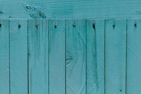 Green Background old rough painted wooden board, closeup