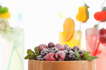 Frozen berries covered with ice . Refreshing summer cocktails with fruit, berries and mint.の写真素材