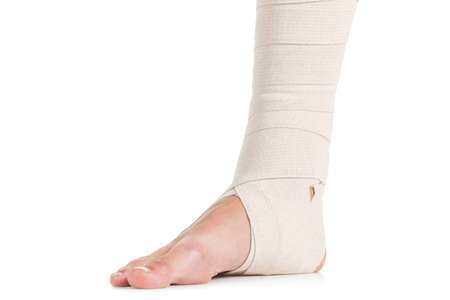 Flexible elastic supportive orthopedic bandage with white background, compression stabilizer ankle.の写真素材