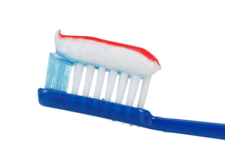 Toothbrush with toothpaste closeup isolated on white background