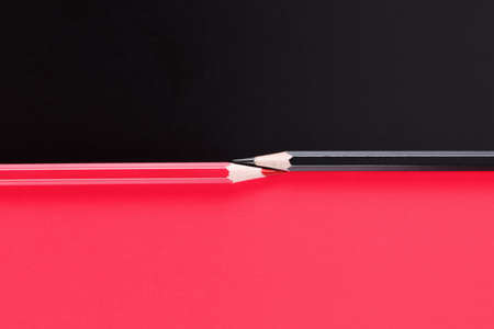 Competition, teamwork, partnership concept with black and red pencil on paper. For business concept.の写真素材