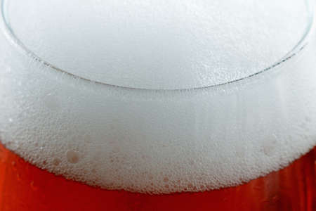 Background beer with foam and bubbles macroの写真素材