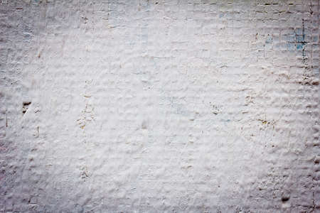 old white cracked painted tiles as backgroundの写真素材