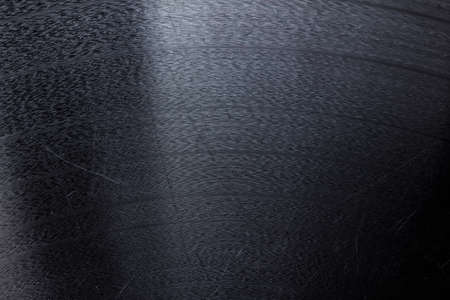 Segment of vinyl record showing the texture of the grooves, retro lookの写真素材