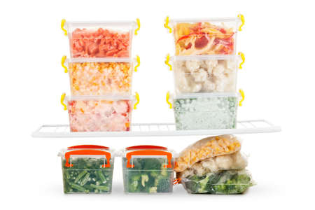 Frozen food in the refrigerator. Vegetables on the freezer shelves. Stocks of meal for the winter.の写真素材