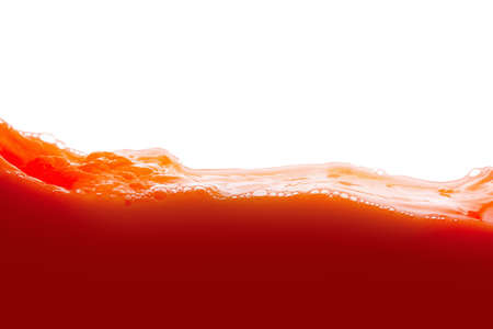 Tomato juice splash isolated on white background. Healthy fresh drink, wave with dropの写真素材