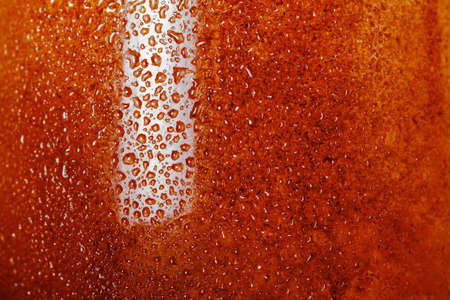 Cola background with bubble, condensation closeup. Macro wet glass with soda water, liquid drink closeup.の写真素材