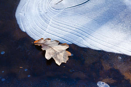 Ice pattern background on the surface of the pond or river. Macro frost crystal winter designの写真素材