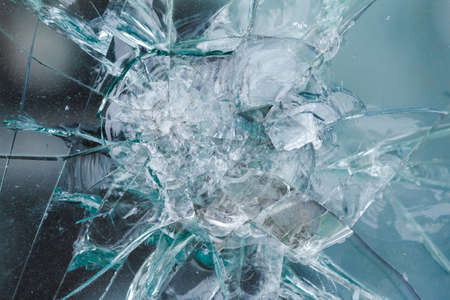 Bulletproof glass background, bullethole from the bullets, cracks and broken. Criminal conceptの写真素材