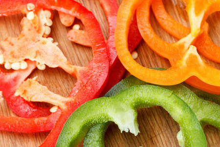 Food background. Colorful vegetable bell pepper on cutting boardの写真素材