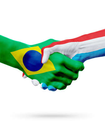 Flags Brazil, Luxembourg countries, handshake cooperation, partnership, friendship or sports team competition concept, isolated on whiteの写真素材
