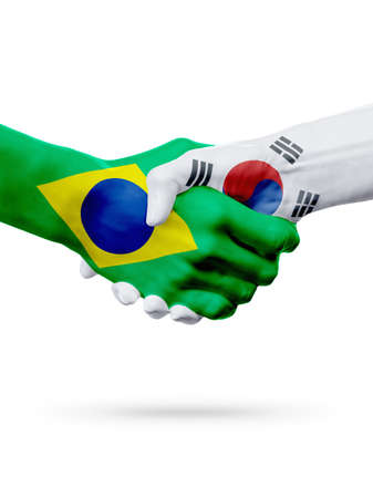 Flags Brazil, South Korea countries, handshake cooperation, partnership, friendship or sports team competition concept, isolated on whiteの写真素材