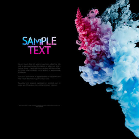 Color splashes of ink isolated on black background. Abstract paint in water, photographed in motion....